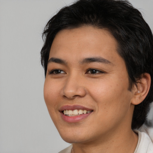 Joyful asian young-adult female with medium  black hair and brown eyes