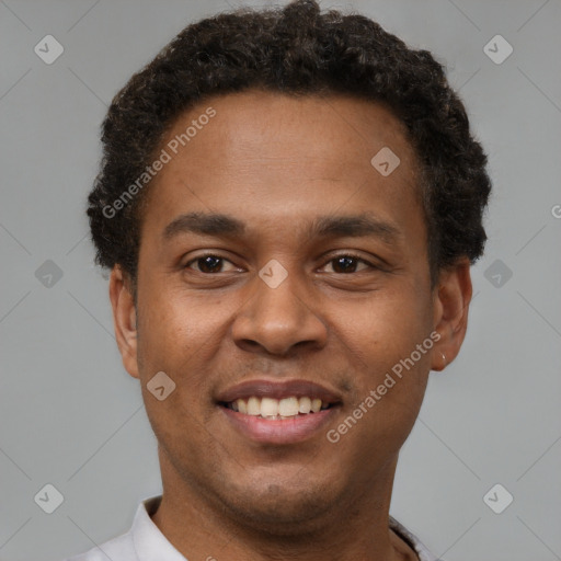 Joyful latino young-adult male with short  brown hair and brown eyes