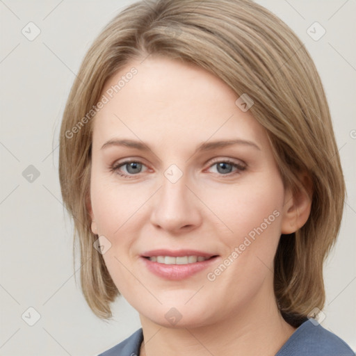 Joyful white young-adult female with medium  brown hair and blue eyes