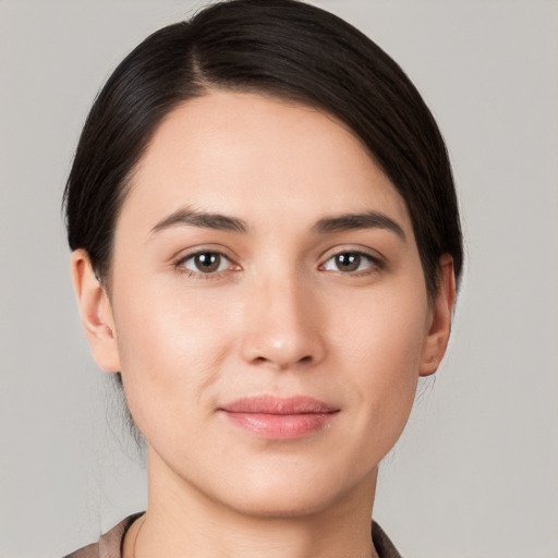 Joyful white young-adult female with medium  brown hair and brown eyes