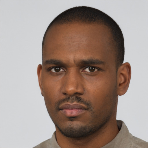 Neutral black young-adult male with short  black hair and brown eyes