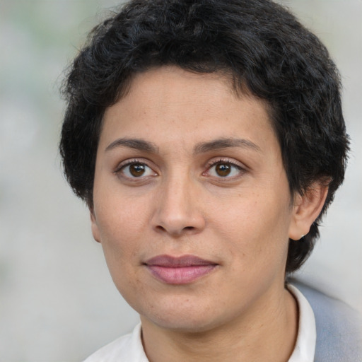 Joyful white adult female with short  brown hair and brown eyes