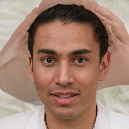 Joyful white young-adult male with short  brown hair and brown eyes