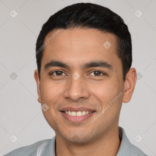 Joyful white young-adult male with short  black hair and brown eyes