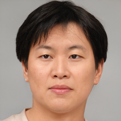 Neutral asian young-adult male with short  brown hair and brown eyes