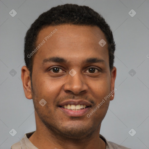 Joyful latino young-adult male with short  brown hair and brown eyes