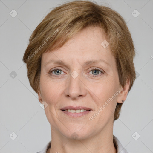 Joyful white adult female with short  brown hair and grey eyes