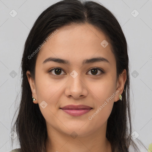 Joyful latino young-adult female with long  brown hair and brown eyes