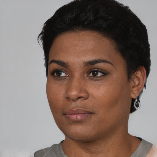 Neutral black young-adult female with short  black hair and brown eyes