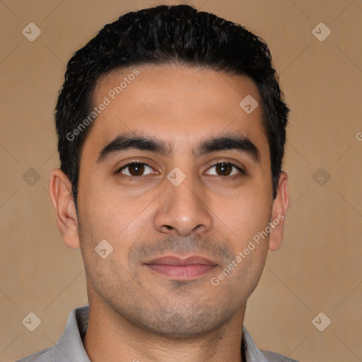 Joyful latino young-adult male with short  black hair and brown eyes