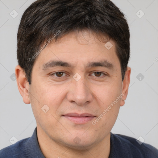 Joyful white adult male with short  brown hair and brown eyes