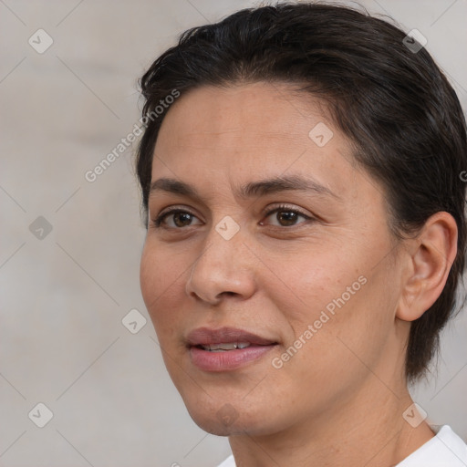 Joyful white adult female with medium  brown hair and brown eyes