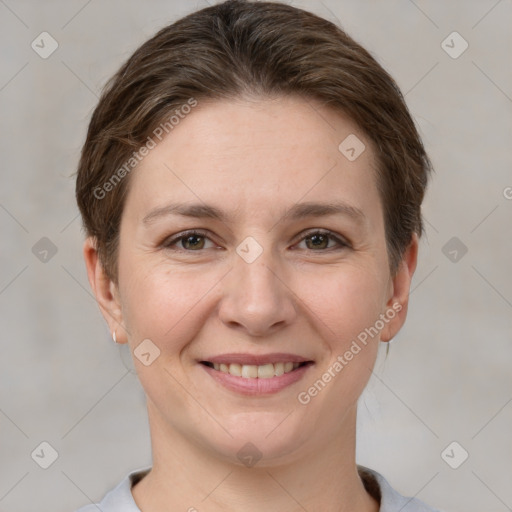 Joyful white young-adult female with short  brown hair and grey eyes