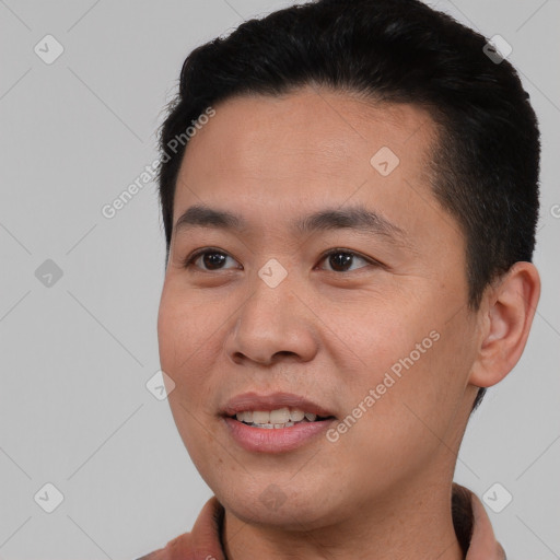 Joyful asian young-adult male with short  black hair and brown eyes