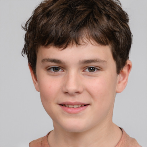 Joyful white child male with short  brown hair and brown eyes