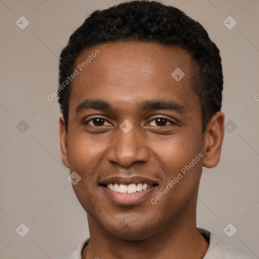 Joyful black young-adult male with short  black hair and brown eyes