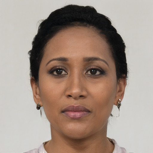 Neutral latino adult female with short  black hair and brown eyes