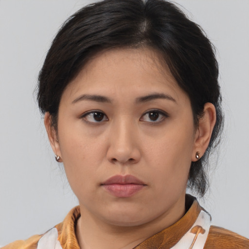 Neutral asian young-adult female with medium  brown hair and brown eyes