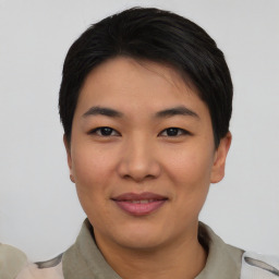 Joyful asian young-adult female with short  black hair and brown eyes