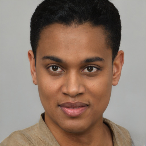 Joyful black young-adult male with short  brown hair and brown eyes