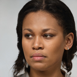 Joyful black young-adult female with medium  brown hair and brown eyes