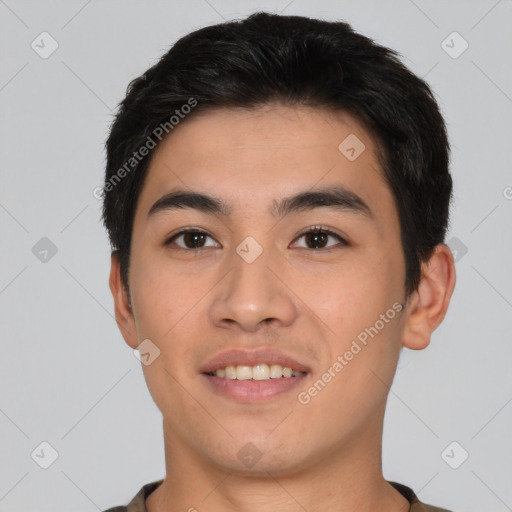 Joyful asian young-adult male with short  black hair and brown eyes