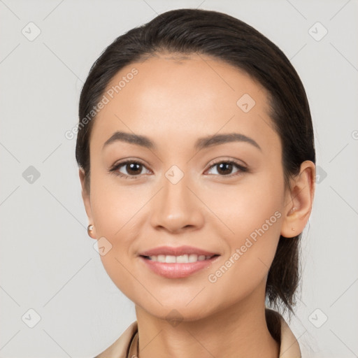 Joyful white young-adult female with long  black hair and brown eyes