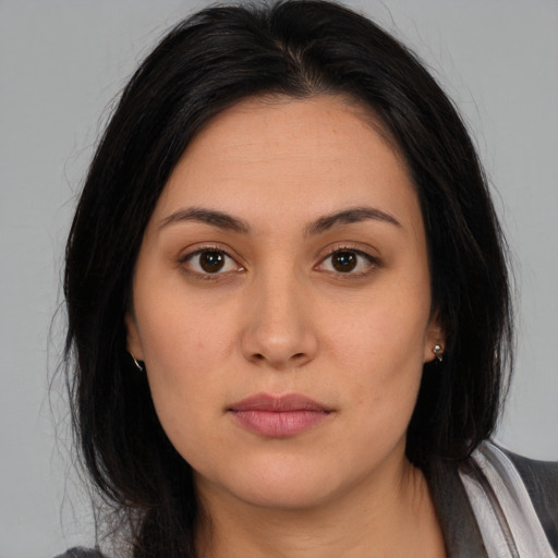Neutral latino young-adult female with medium  brown hair and brown eyes