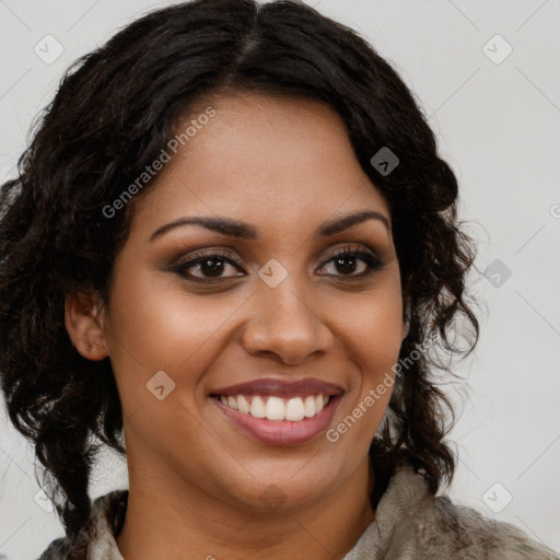 Joyful black young-adult female with long  brown hair and brown eyes