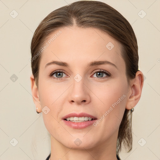 Joyful white young-adult female with medium  brown hair and grey eyes