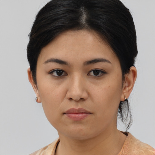 Neutral asian young-adult female with medium  brown hair and brown eyes