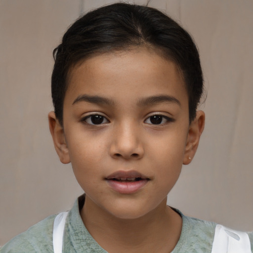 Joyful latino child female with short  brown hair and brown eyes