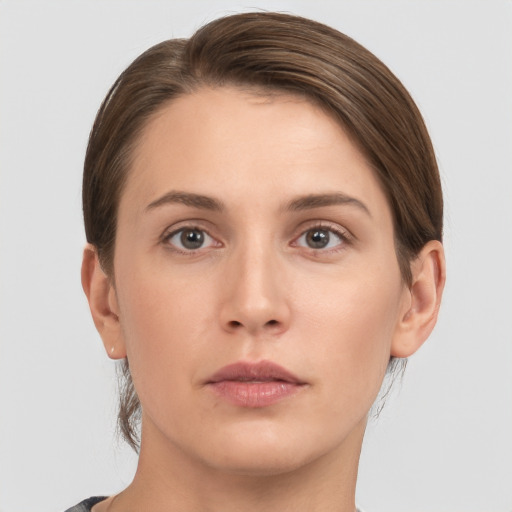 Neutral white young-adult female with short  brown hair and brown eyes