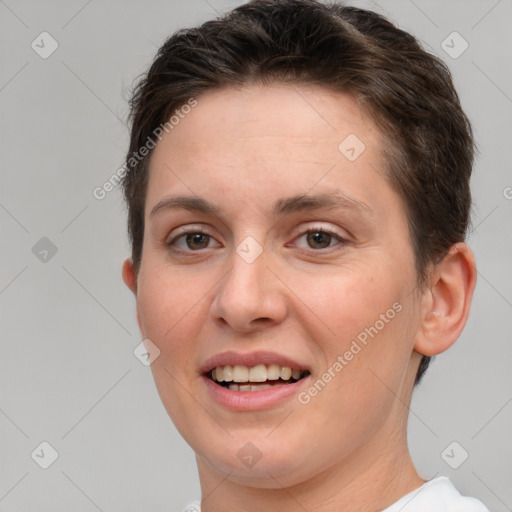 Joyful white young-adult female with short  brown hair and brown eyes