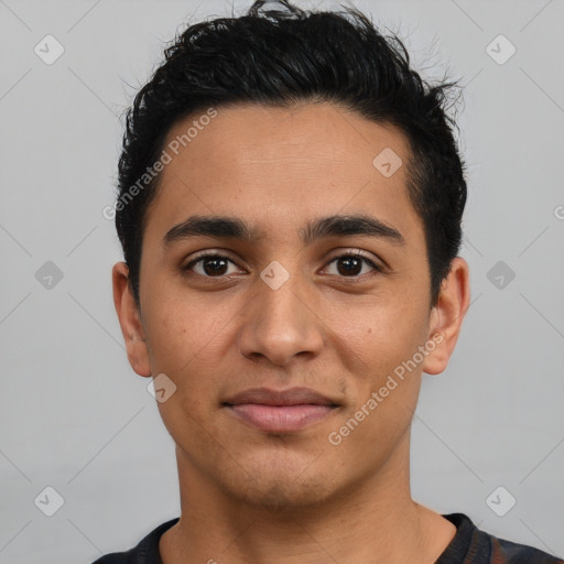 Joyful latino young-adult male with short  black hair and brown eyes