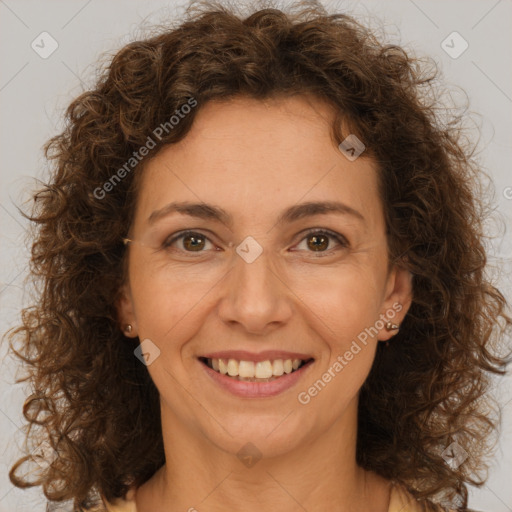 Joyful white adult female with long  brown hair and brown eyes