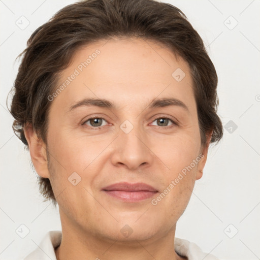 Joyful white adult female with short  brown hair and brown eyes