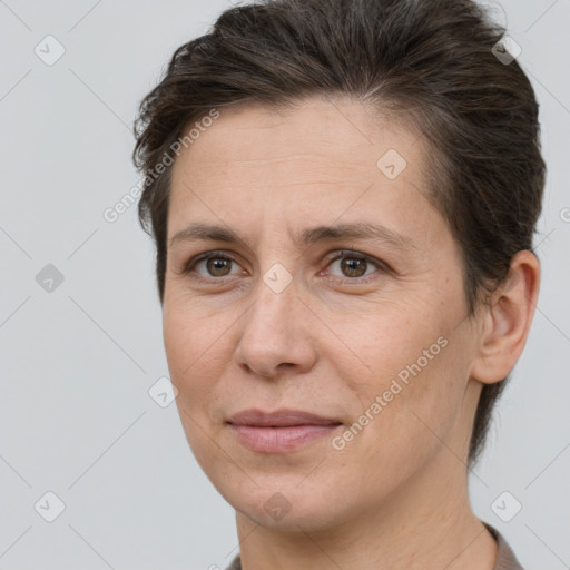 Joyful white adult female with short  brown hair and brown eyes