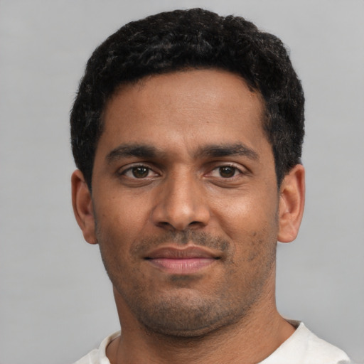 Neutral black young-adult male with short  black hair and brown eyes