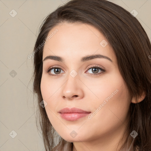 Neutral white young-adult female with long  brown hair and brown eyes