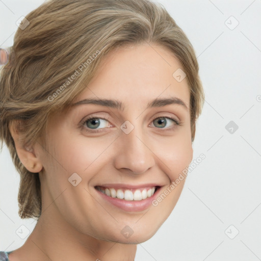 Joyful white young-adult female with medium  brown hair and green eyes