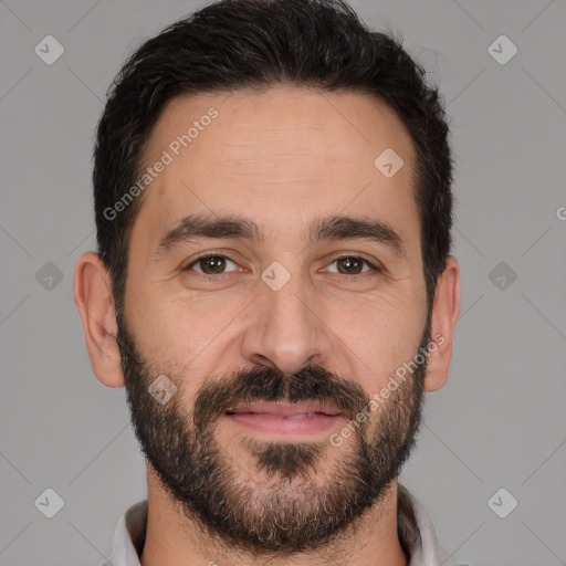 Joyful white young-adult male with short  black hair and brown eyes