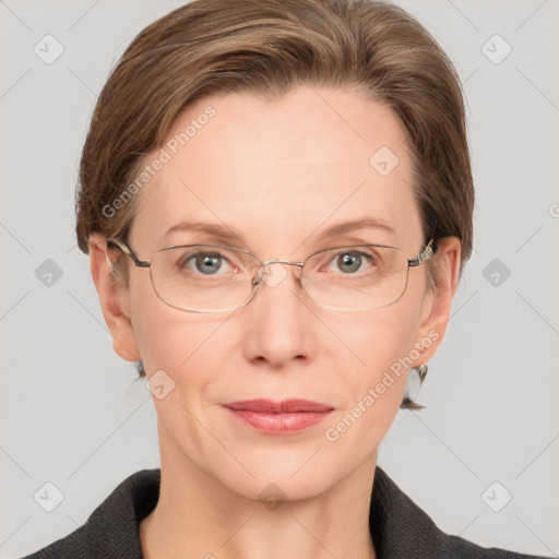 Joyful white adult female with short  brown hair and grey eyes