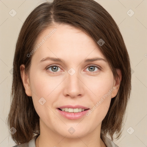 Joyful white young-adult female with medium  brown hair and green eyes