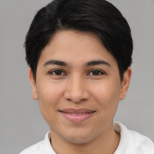 Joyful latino young-adult female with short  black hair and brown eyes