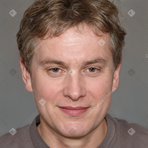 Joyful white adult male with short  brown hair and grey eyes