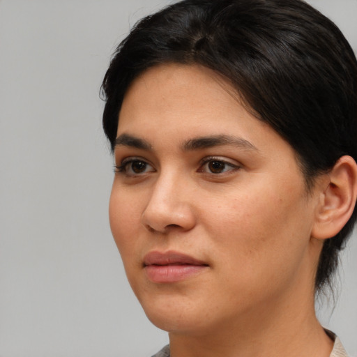 Neutral latino young-adult female with short  black hair and brown eyes