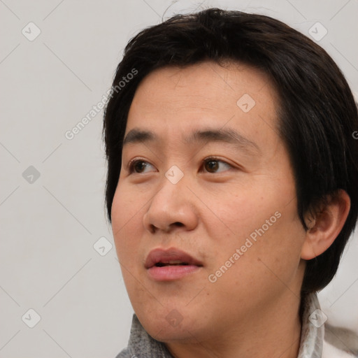 Neutral asian adult male with medium  black hair and brown eyes