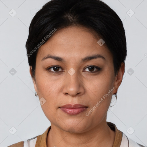 Joyful latino young-adult female with short  brown hair and brown eyes