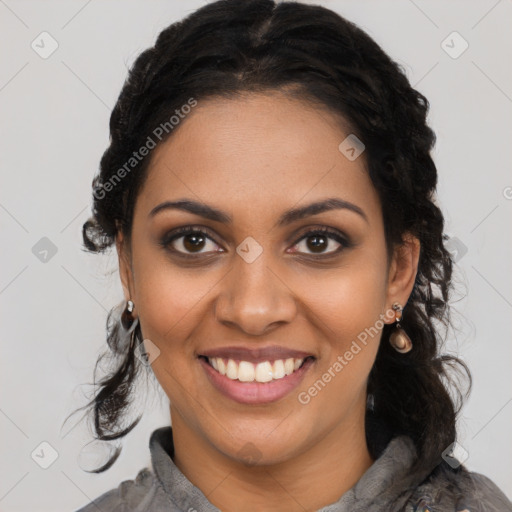 Joyful black young-adult female with long  black hair and brown eyes